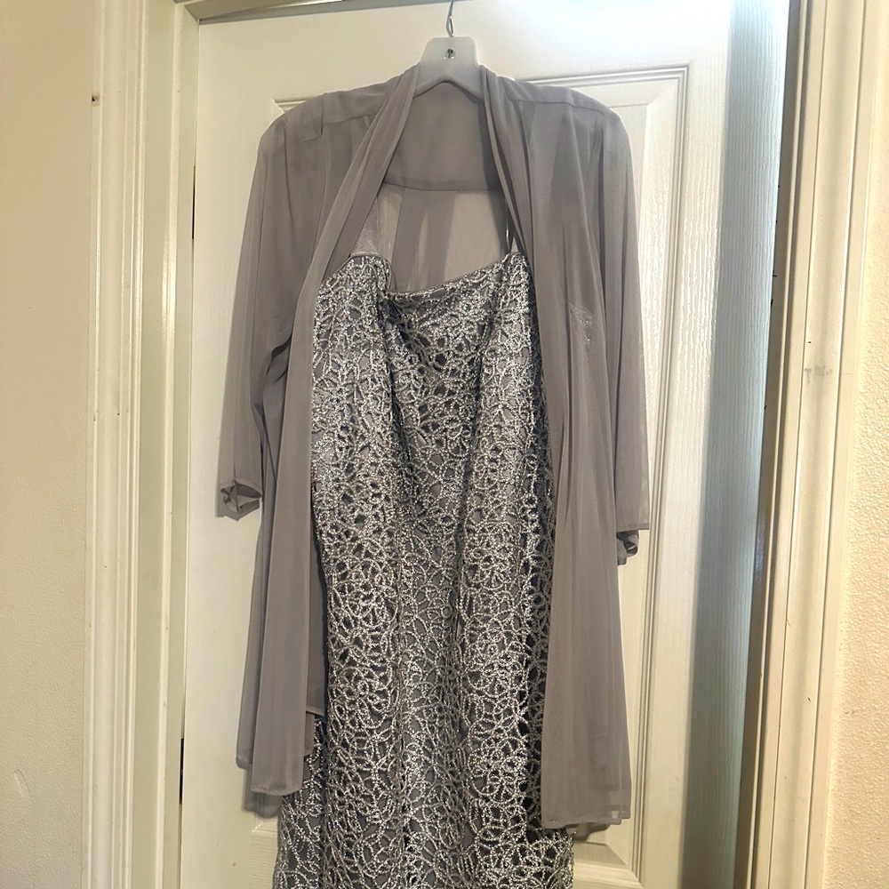 Silver, knee length R&M Richard’s 16WP dress. Purchased from David’s Bridal.